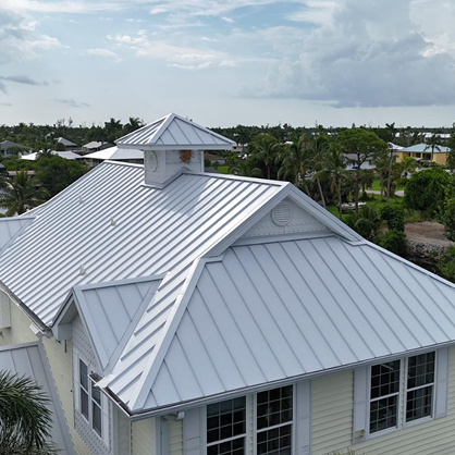 5166 Martin Cove, Bokeelia 33922 Three Story Installation of 1.5’’ Snaplock Standing Seam Kynar Finish AluminumG